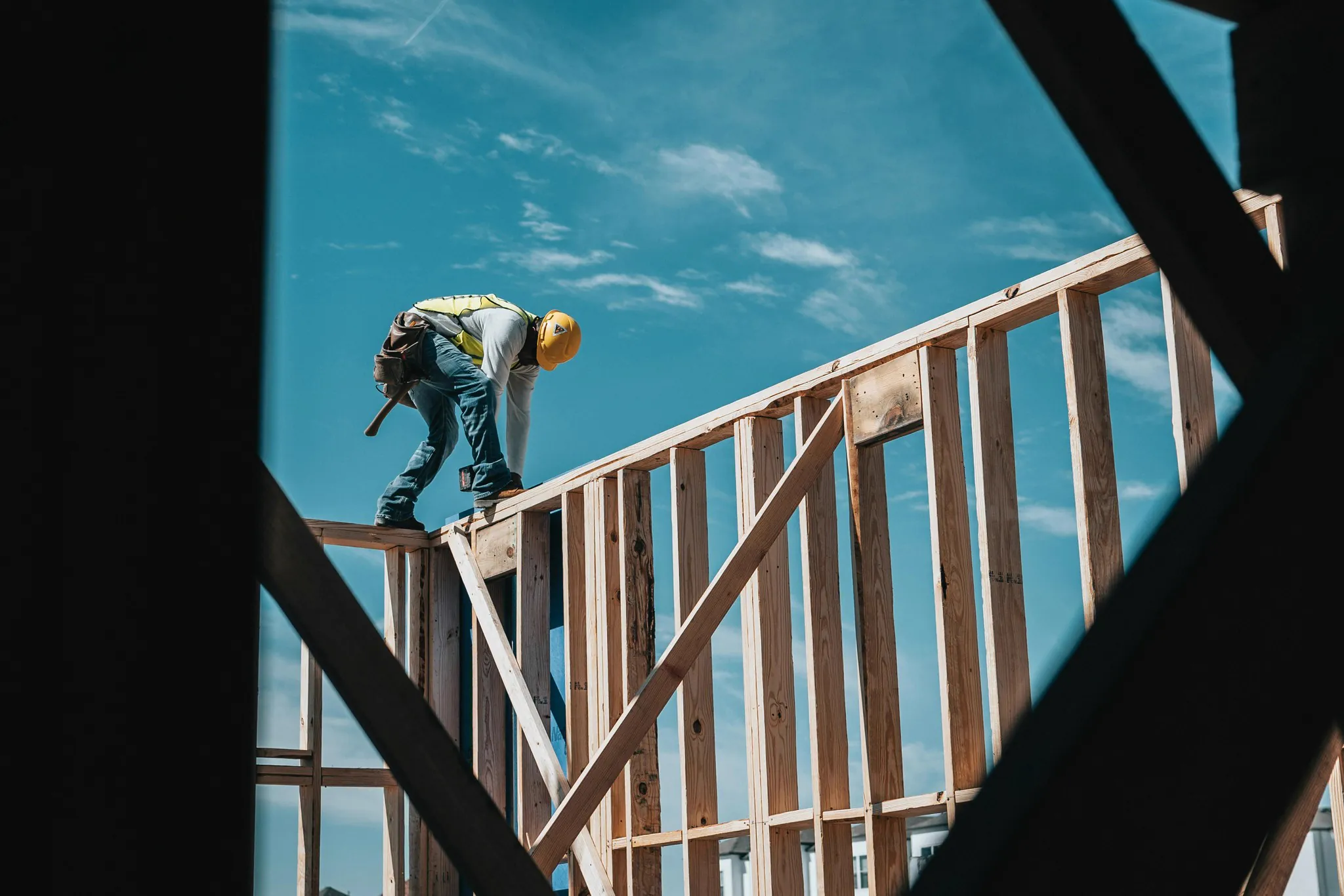construction worker in hard hat on building frame